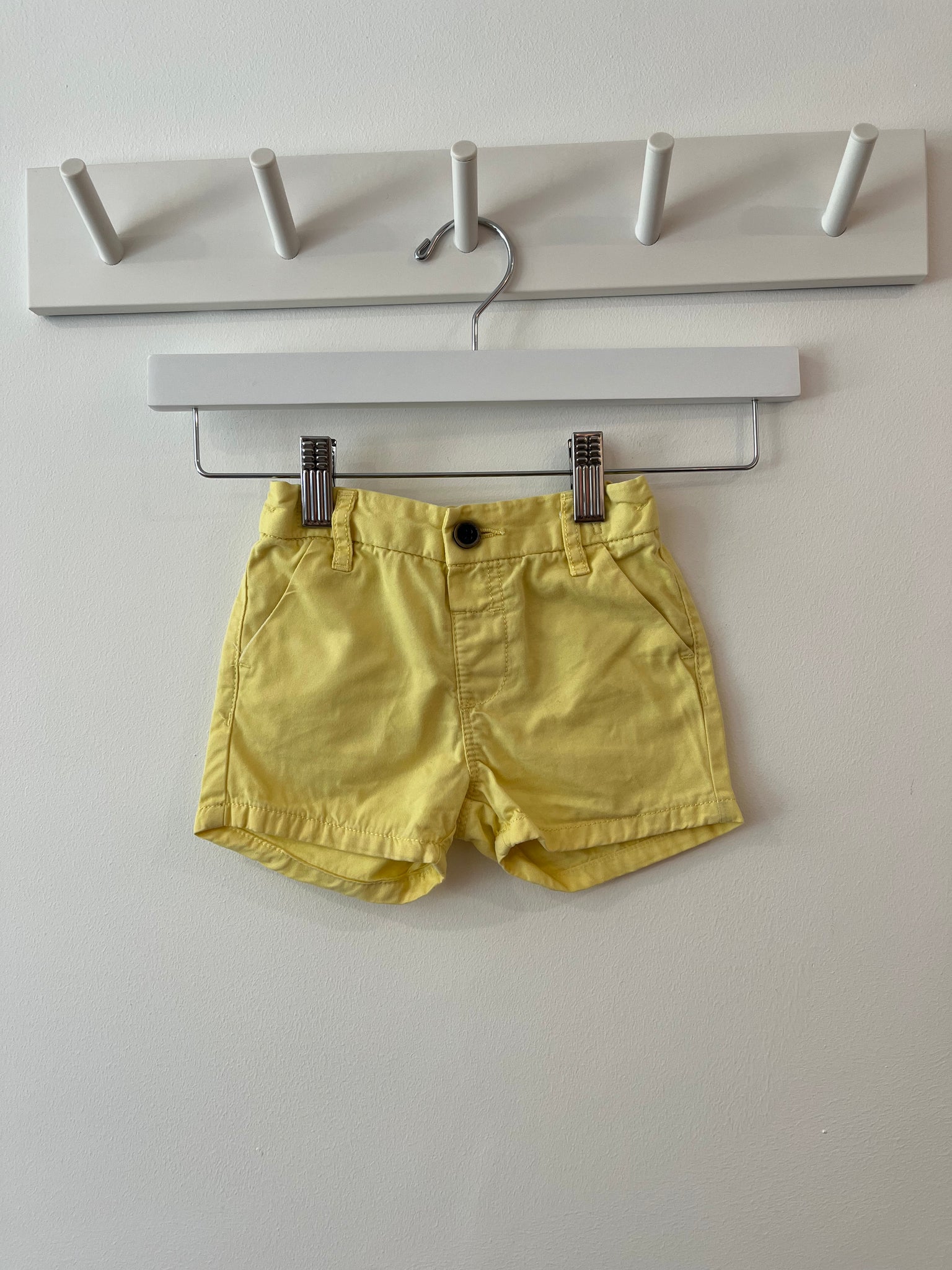 Next yellow shorts (6-9m)